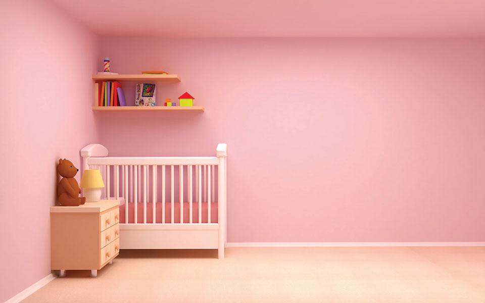 A bedroom with bubblegum pink walls.