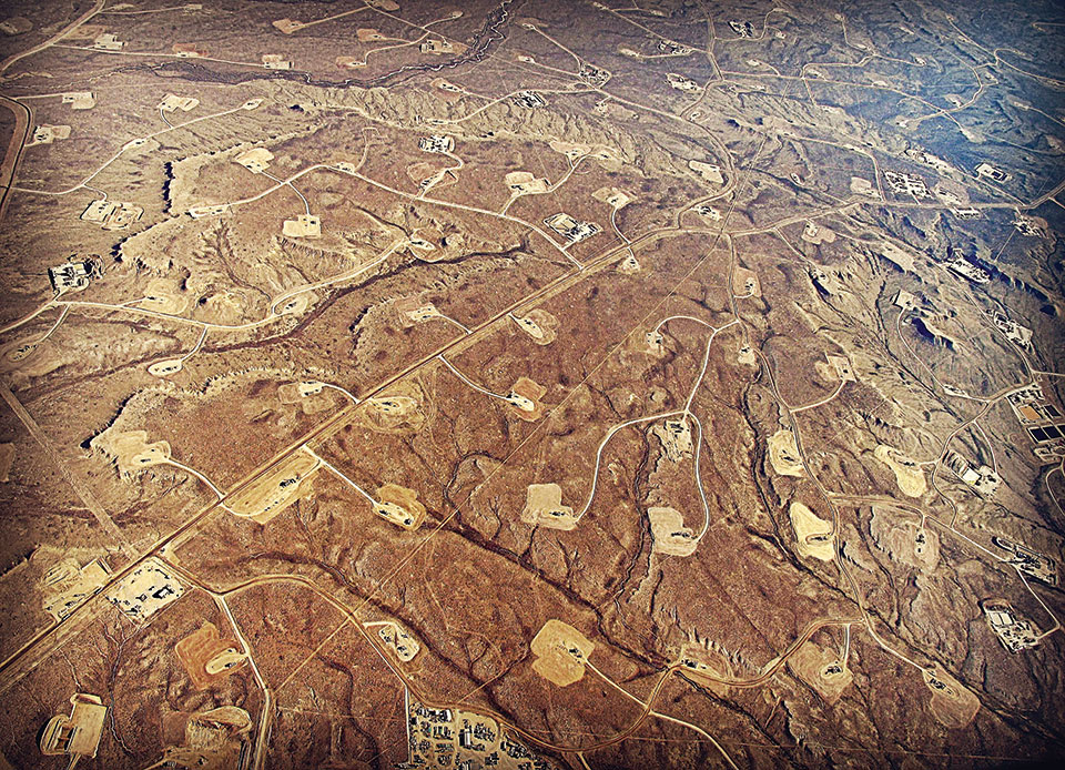 An aerial view of hydraulic fracturing in progress at Jonah Field in Wyoming.