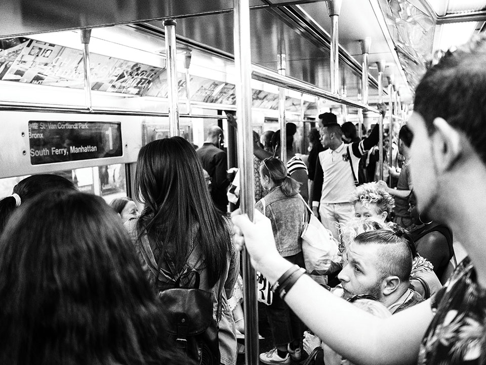 People on a crowded NYC subway. Photo: Jason Devaun