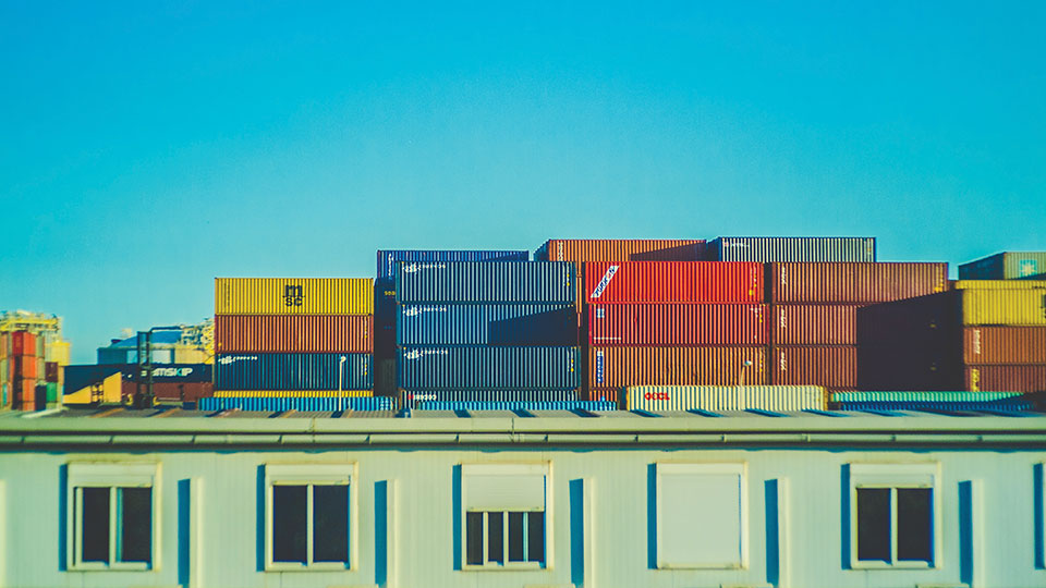 Stacks of shipping containers in primary colors