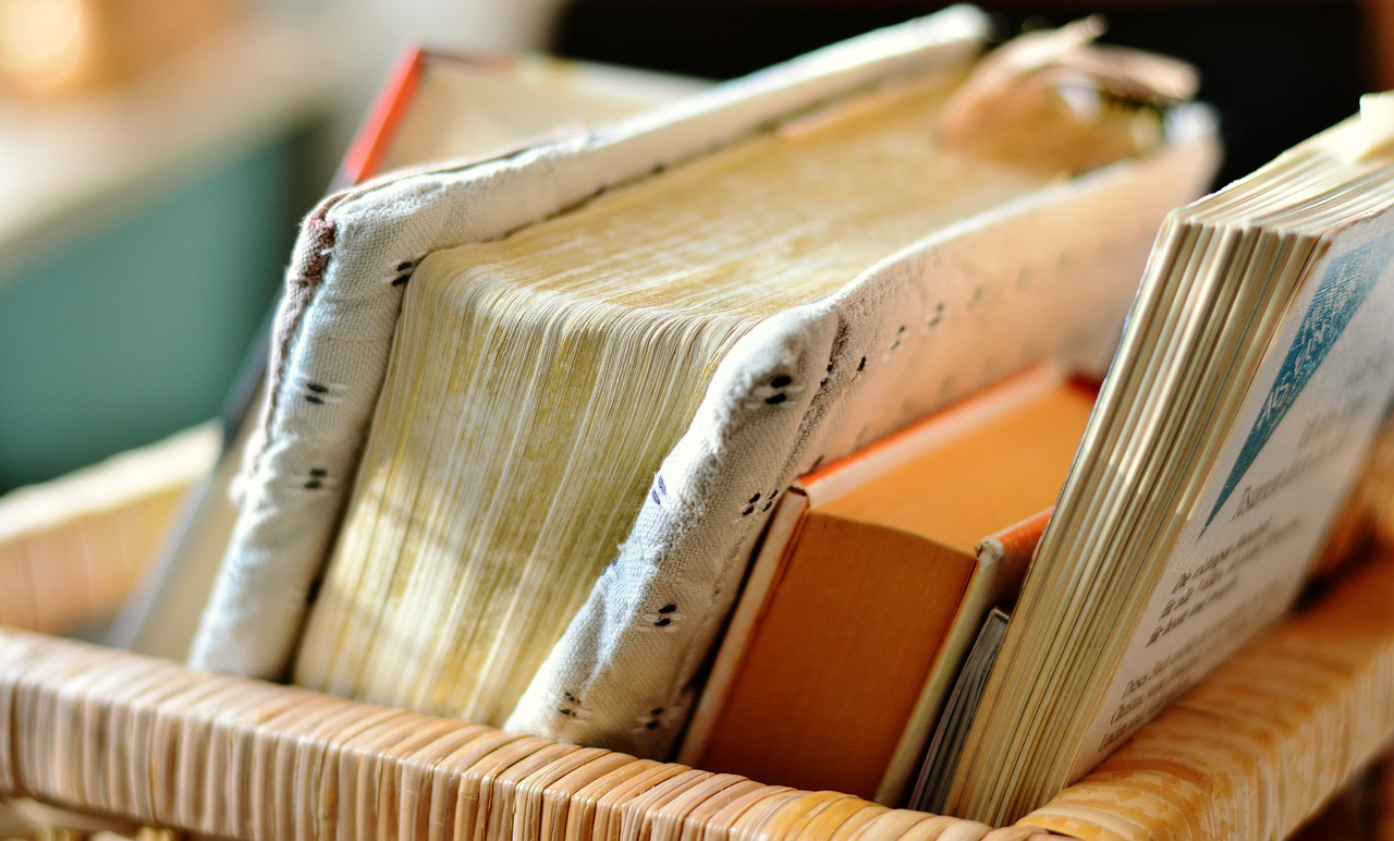 Books in a basket with warm sunlight