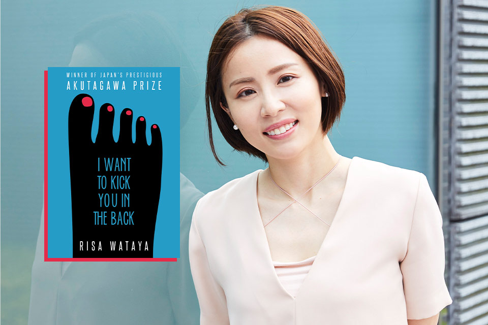 A photograph of Risa Wataya with the cover to her book I Want to Kick You in the Back