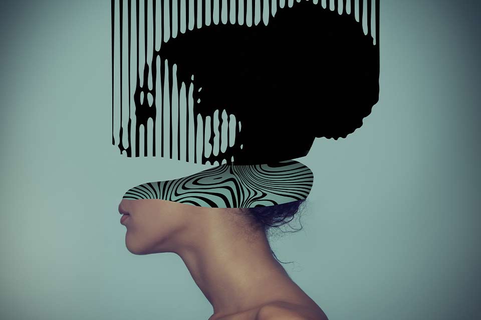 A photograph of a woman's head in profile progressively turns into digital imagery, characterized by only ink and spaces