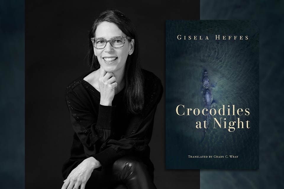 Gisela Heffes with the cover to her book in translation Crocodiles at Night