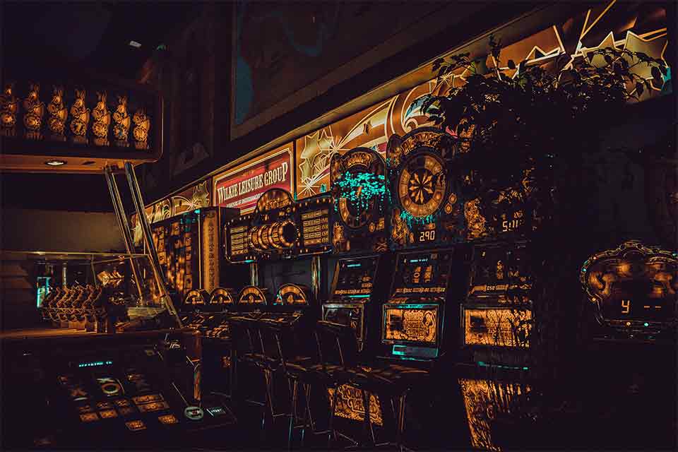 A photograph of a wall of slot machines, rendered through a surreal reverse image filter