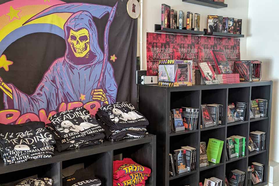 Photograph of the t-shirt section inside Little Ghosts Books