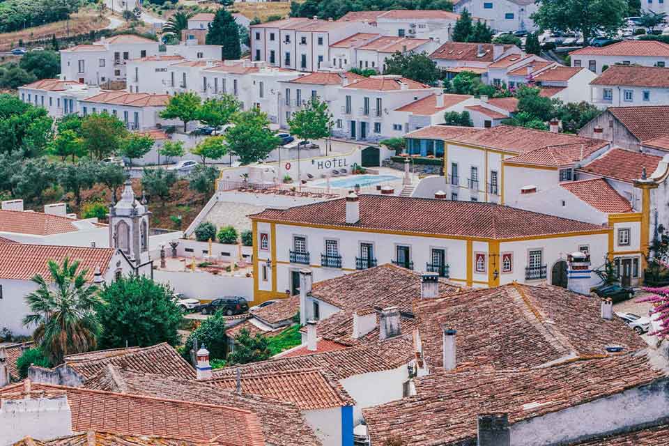 An aerial photograph of a neighborhood in Óbidos, Portugal