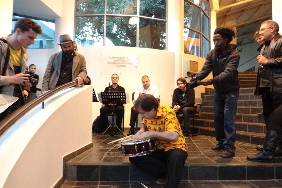A group of musician playing on a stairwell