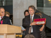 Mia Couto receiving the Neustadt feather. Photo by Vanesssa Rudloff.