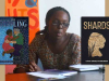 Cynthia Marangwanda with the covers to her books The Toppling and Shards