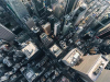 An aerial view of New York looking down on a skyscraper