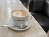 A cup of coffee with stylized cream