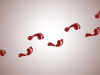 Footprints made in red across a white surface