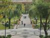 A paved walkway juts out into a natural landscape in an urban park