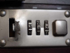 A close-up view of a combination lock on a briefcase