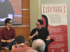 A photograph of Trung Lê Nguyễn and Gene Luen Yang talking at the 2023 Neustadt Lit Fest