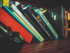 Books leaning on a shelf