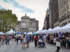 The vendor booths line up in downtown Brooklyn, right in  front of Brooklyn Borough Hall.