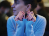 Sarah Ladipo Manyika sits, looking away from the camera, in a blue sweater