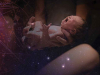 A collage image of a pair of arms holding a crying baby with the night sky full of stars superimposed on it