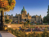 A photograph of. Parliament building, Victoria, BC; with inner harbor summer activities underway all around