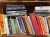 A photograph of a book shelf, crowded with books