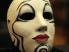 An ornately painted harlequin mask