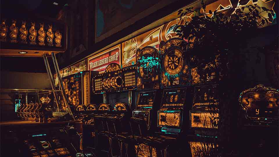 A photograph of a wall of slot machines, rendered through a surreal reverse image filter