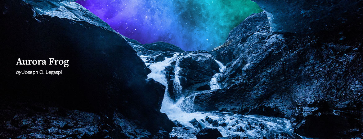 A river flows into the mouth of a darkened cave over rocks, creating a froth. The sky outside the cave is lit up with an aurora borealis