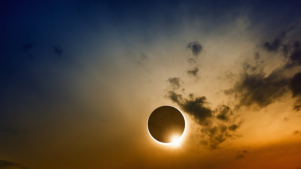 A solar eclipse in a darkened sky