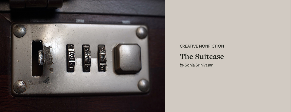 A close-up view of a combination lock on a briefcase