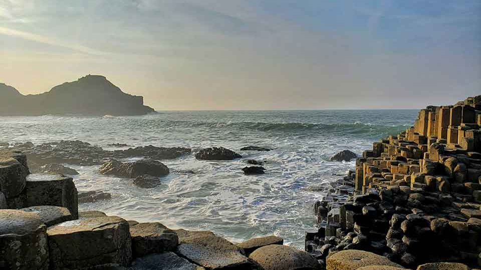 Waves crash on a rocky shore
