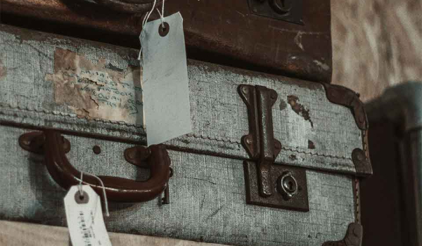 A row of bottles against a lit background as seen through a translucent filter
