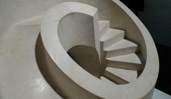 A sculpture from above of a curved staircase that leads down to nowhere