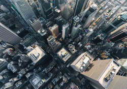 An aerial view of New York looking down on a skyscraper