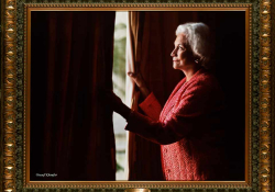 A photograph of Justice Sandra Day O'Connor peering out through a heavy curtain to the daylight outside