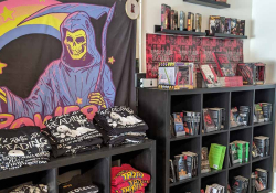 Photograph of the t-shirt section inside Little Ghosts Books