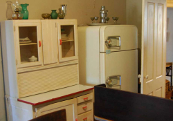 A photograph of a somewhat dated looking kitchen apartment