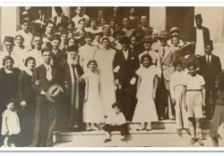 A black and white photograph of a wedding party
