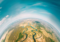 An aerial shot high above the Earth, taken with a fish-eye lens