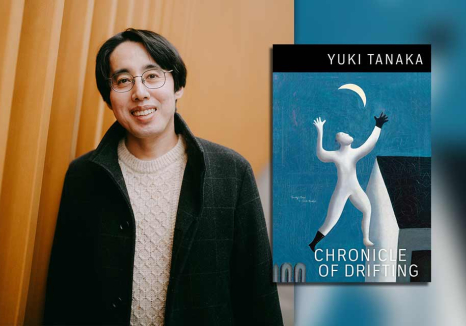 Yuki Tanaka with the cover to his book Chronicle of Drifting 